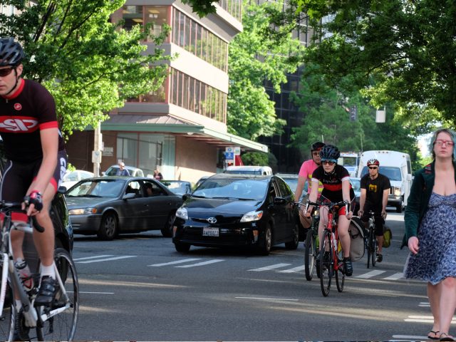 Bikes cars and pedestrians