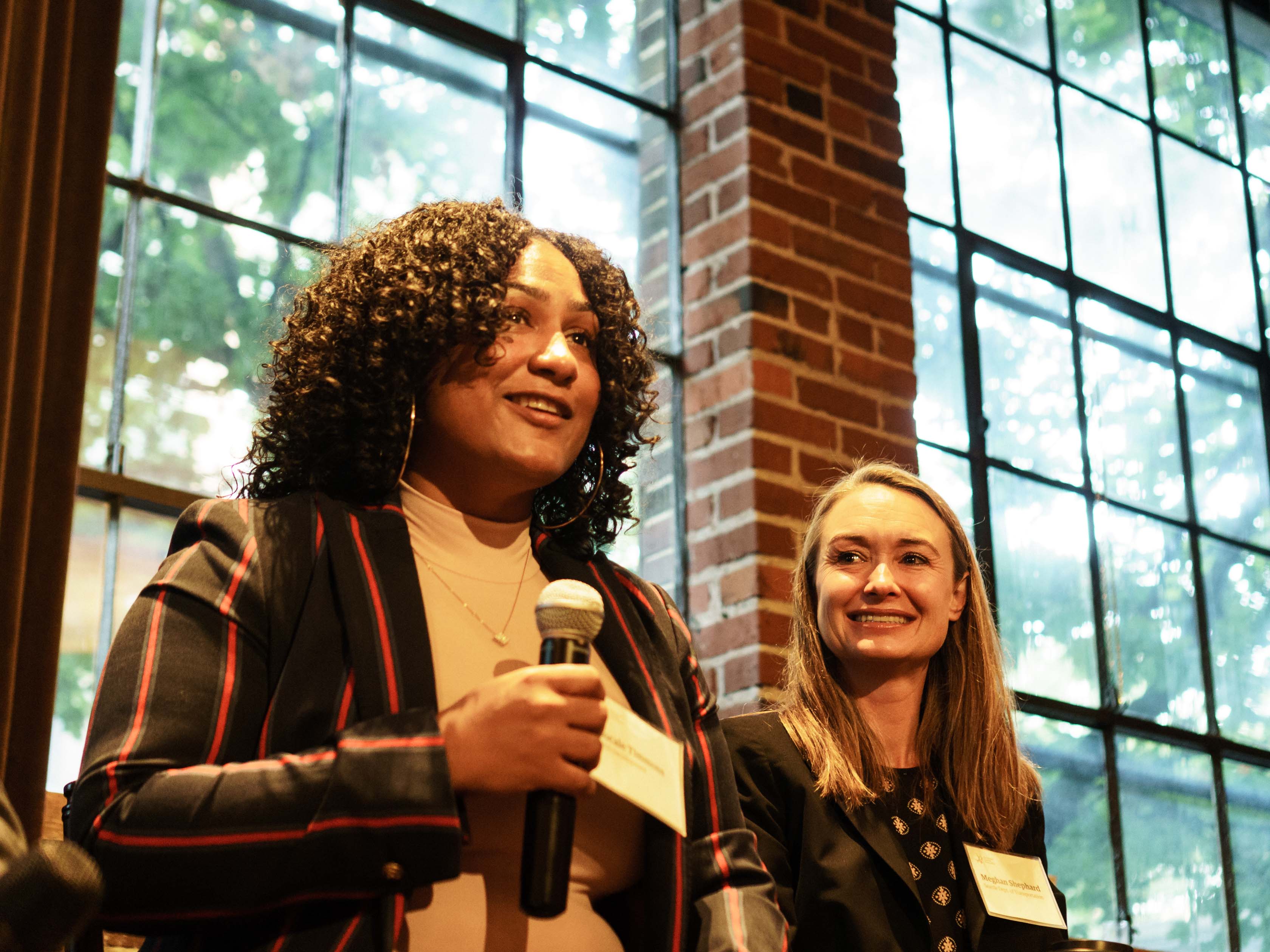 Women leading a panel discussion