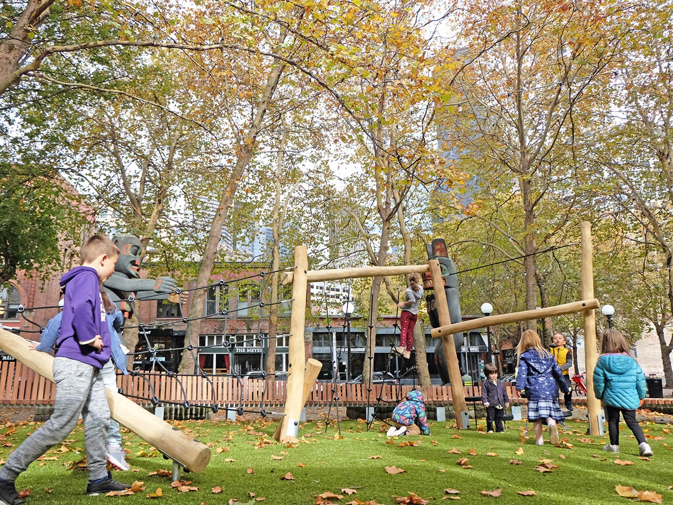 Kids playing in the playspace at Occidental Square