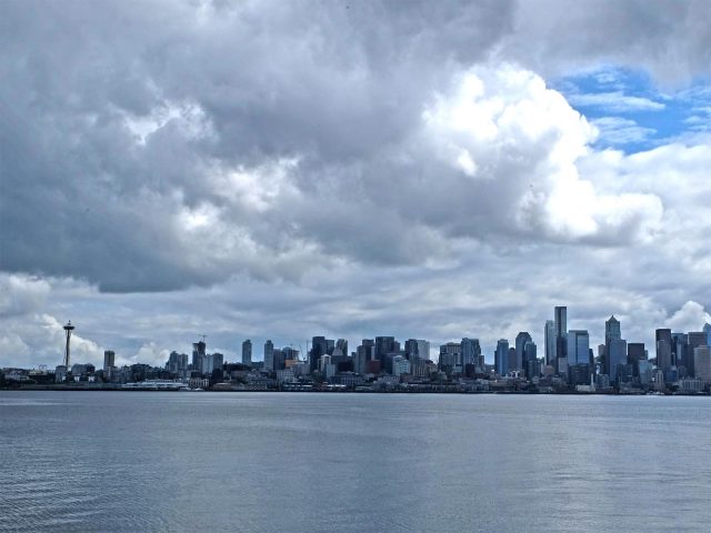 Seattle skyline, cloudy sky, water