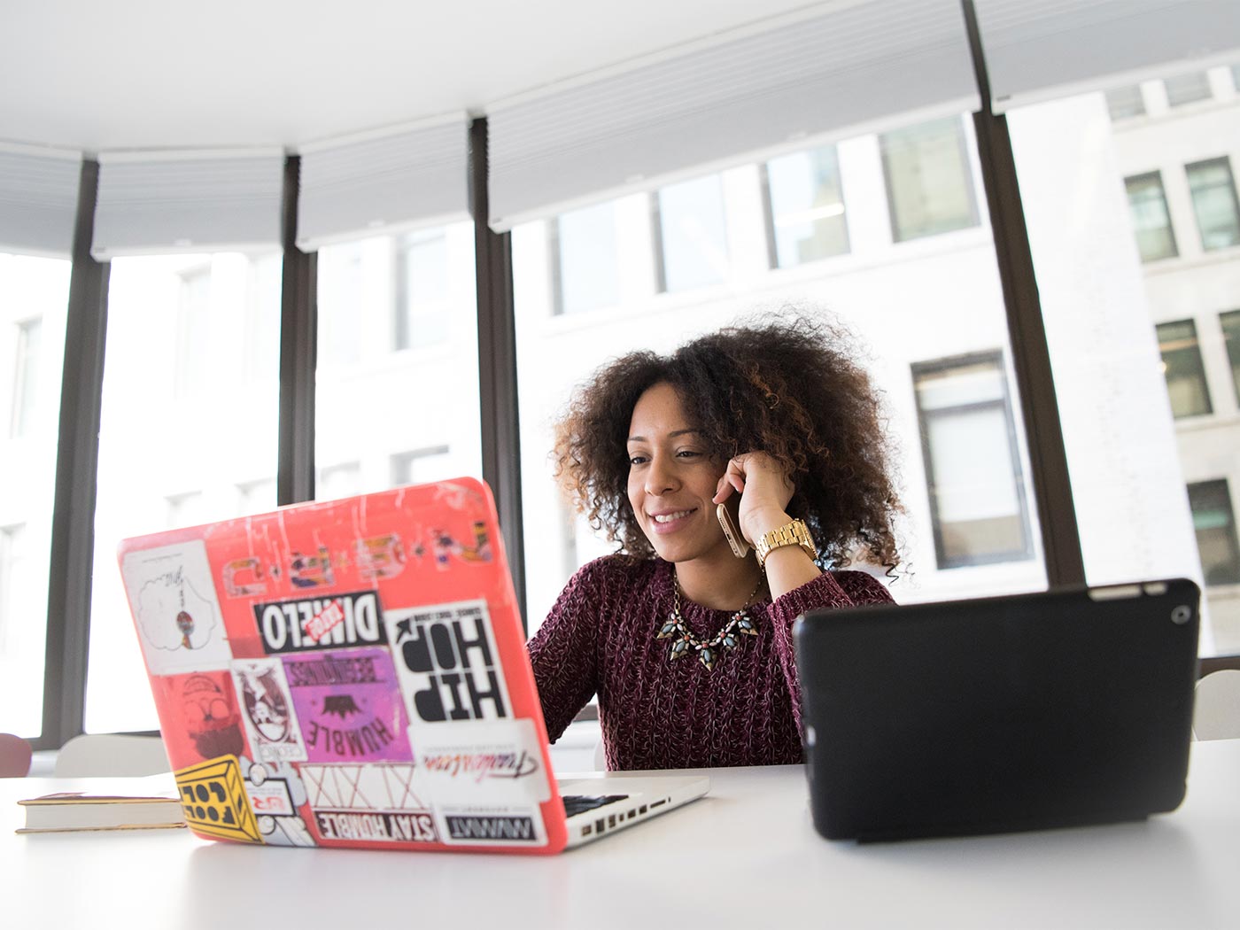 Woman on video call in front of windows