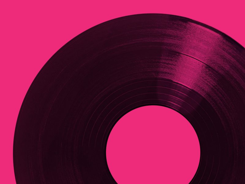 Vinyl record on pink background