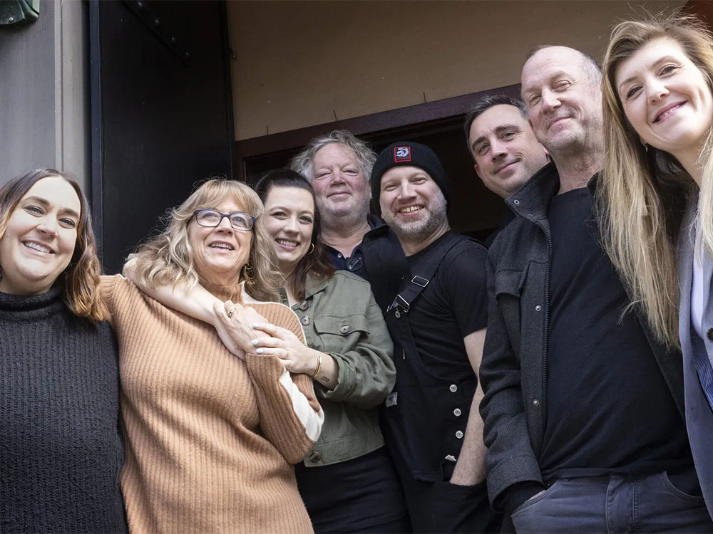 Restaurateur Tom Douglas, fourth from left, with his team at the Palace Kitchen in downtown Seattle on Friday. Palace Kitchen will reopen April 21. With Douglas, from left, are Amy Richardson, director; Jackie Cross, owner; Loretta Douglas, owner; Ron Anderson, chef; Brock Johnson, director; Sean Hartley, owner; and Kristen Burns, general manager.