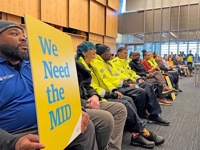 MID workers and supporters at a City Council meeting