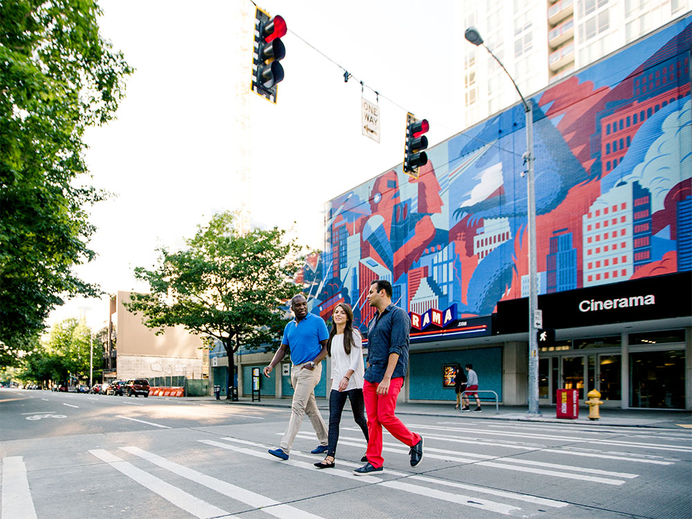 People walking outside of Cinerama in downtown Seattle