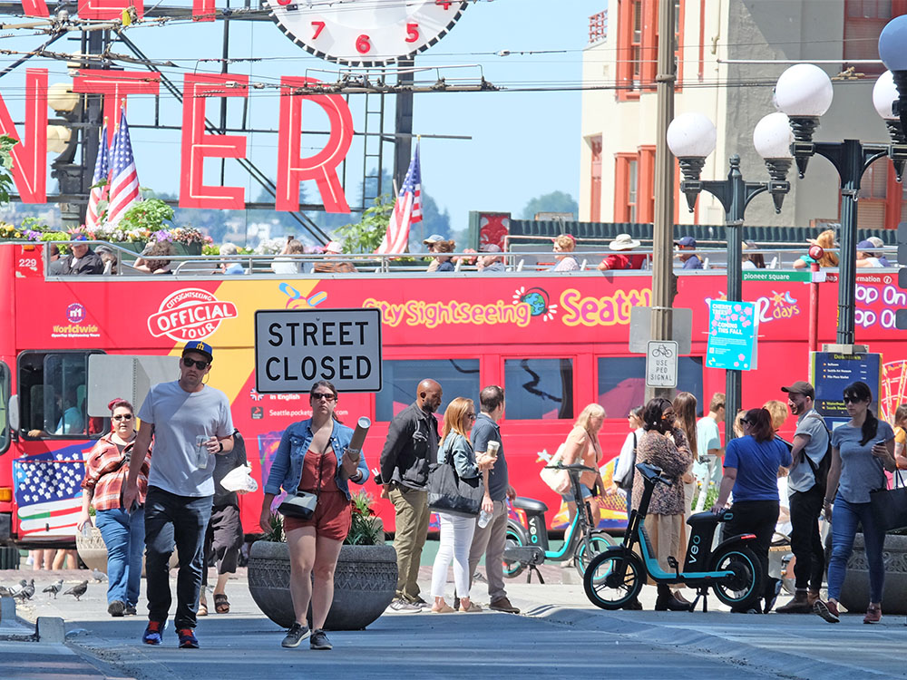 Pedestrians and tour bus at Pike Place Market