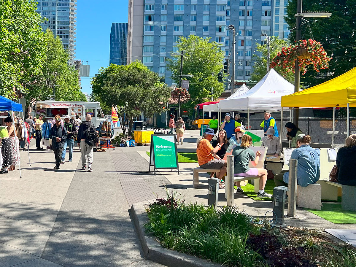 Visitors and activities at Bell Street Park on a sunny day