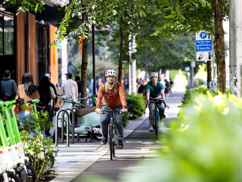 Bike commuter on protected bike lane in South Lake Union in downtown Seattle