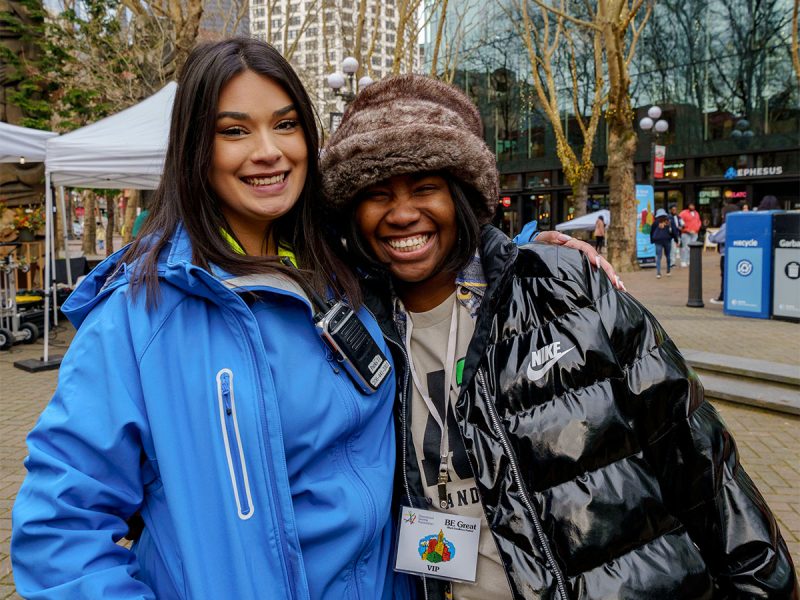 Two downtown ambassadors smiling in Occidental Square