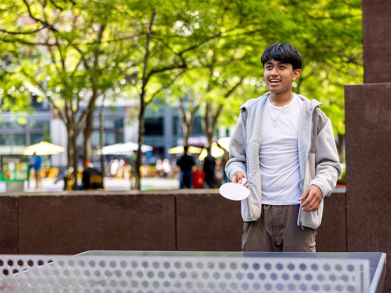 Young person playing ping pong in Westlake Park