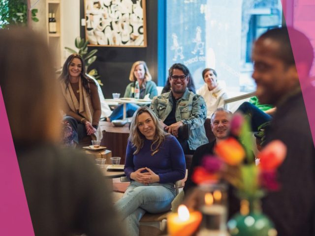 People sitting and smiling.