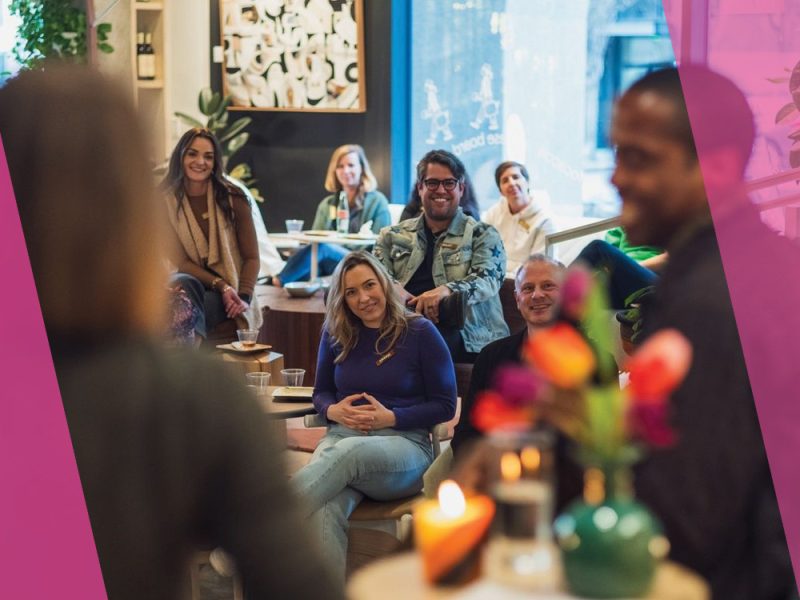 People sitting and smiling.