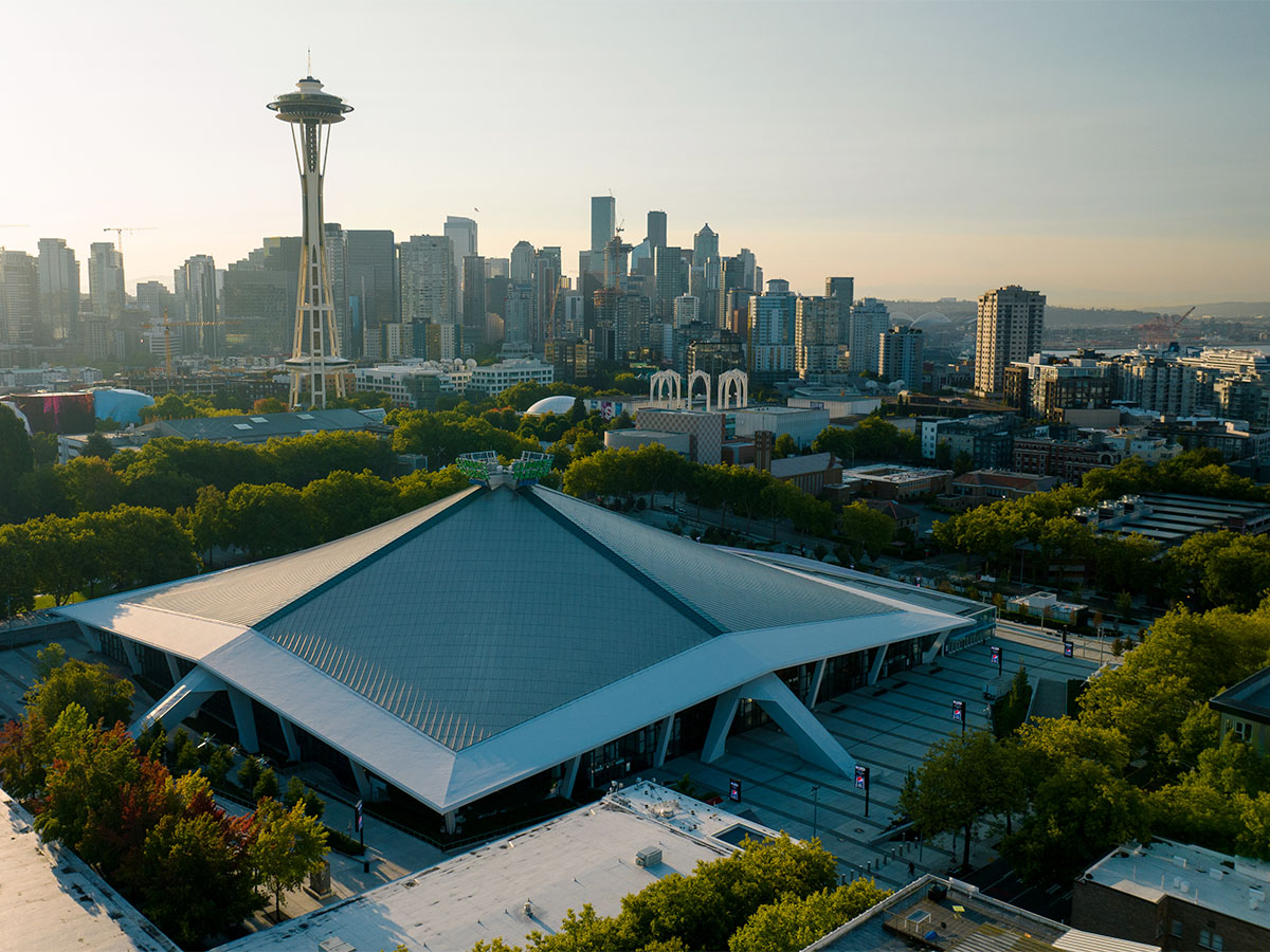 Climate Pledge Arena and Seattle cityscape in background with Space Needle