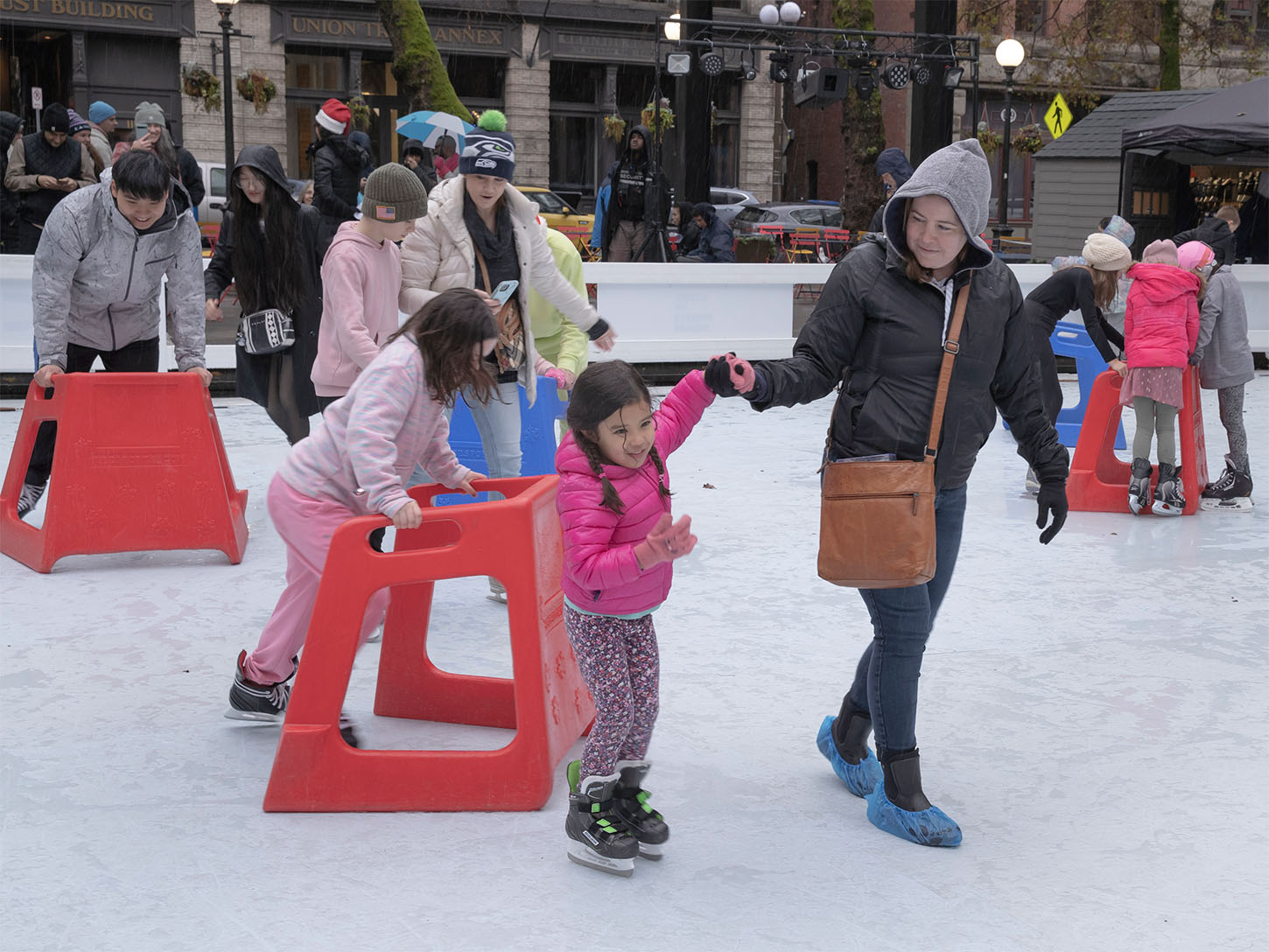 Family ice skating at Occidental Square