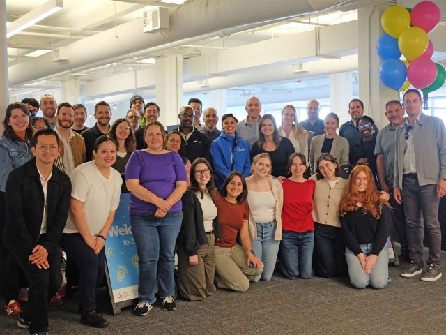 Staff smiling in new office space