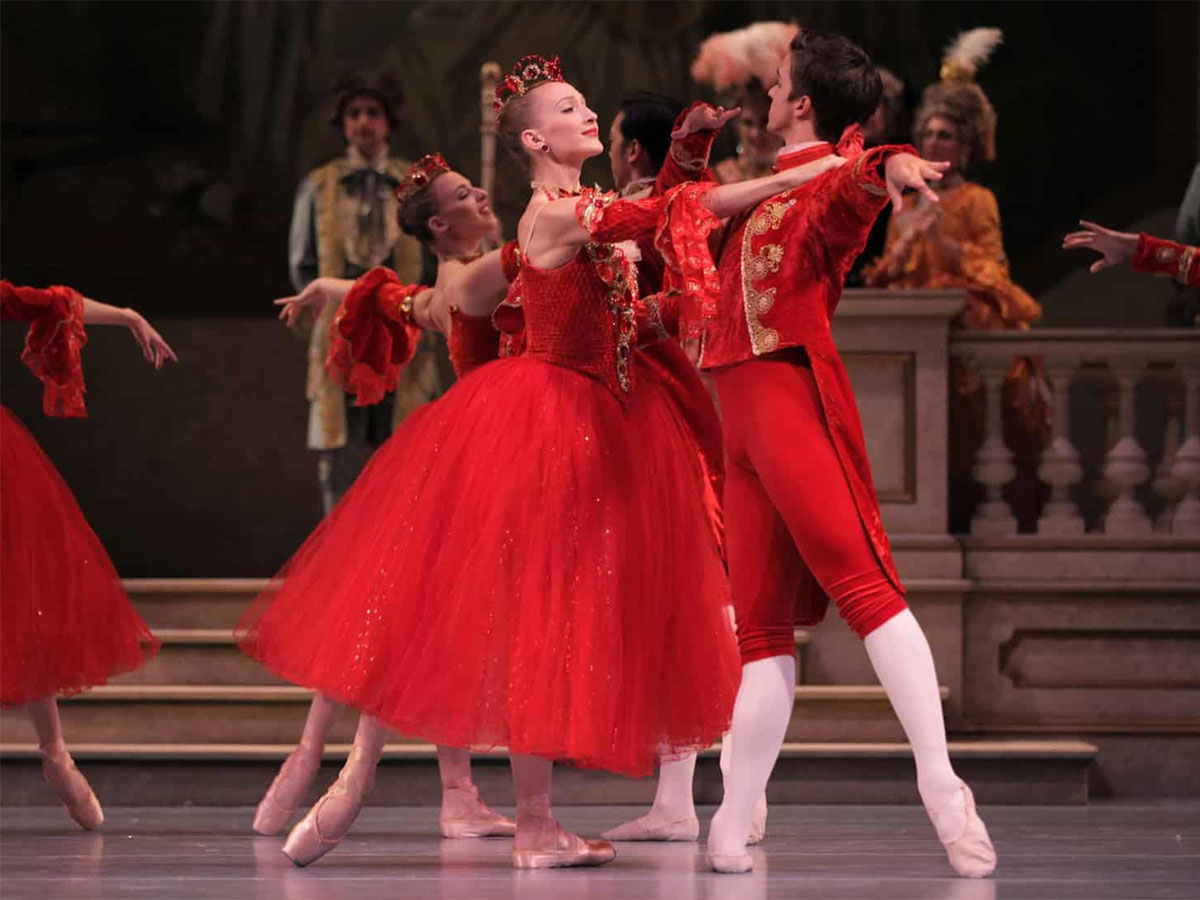 Ballerinas dancing, wearing red