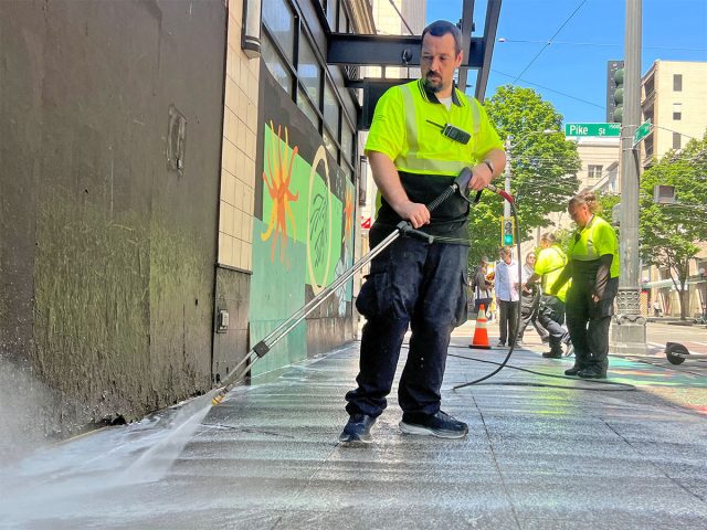 MID clean team ambassador power washing a sidewalk