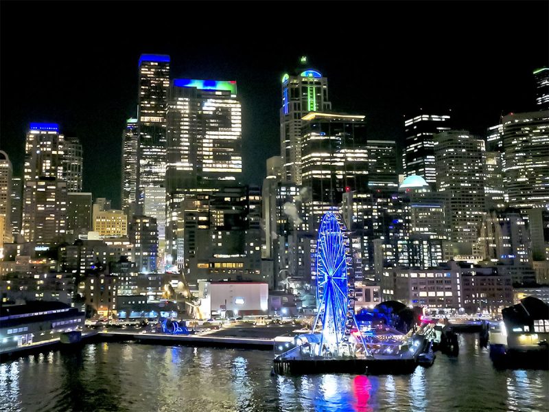 12th man lights on building near downtown Seattle waterfront at night