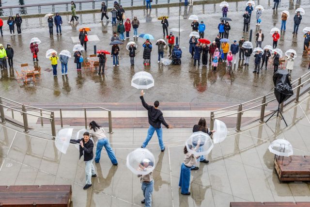 Umbrella dancers and audience