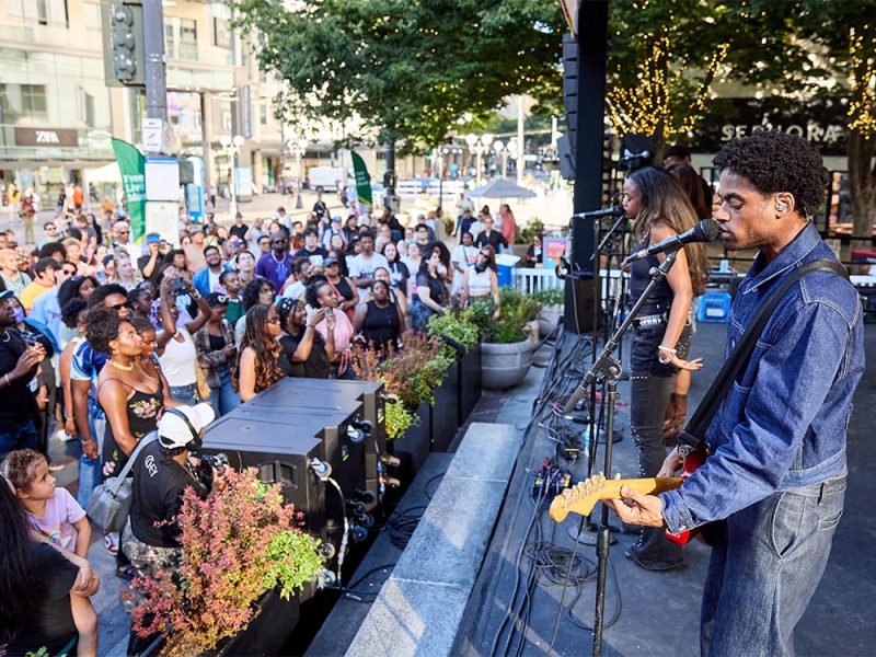 Band performing on a stage in front of audience