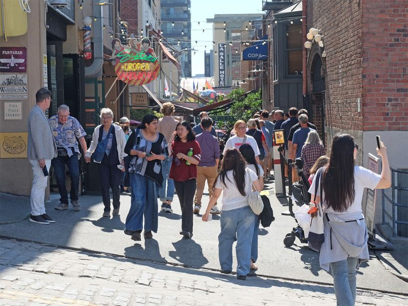 Visitors at Pike Place Market's Post Alley