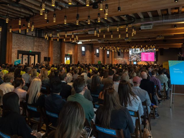 A large crowd looks on during the 2025 DSA/MID Annual Meeting in SoDo.