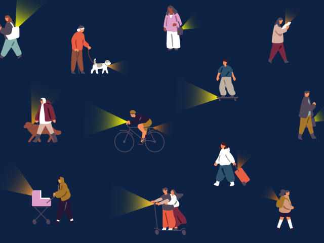 Commuters with lights, riding bikes, scooters, skateboards and walking dogs.